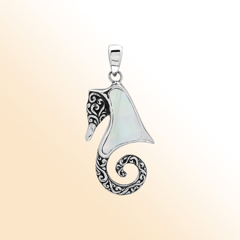 Elegant sterling silver seahorse pendant with luminous Mother of Pearl inlay, artisan-crafted for tropical ocean-inspired style.