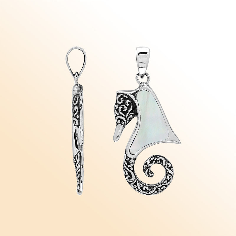 Elegant sterling silver seahorse pendant with luminous Mother of Pearl inlay, artisan-crafted for tropical ocean-inspired style.