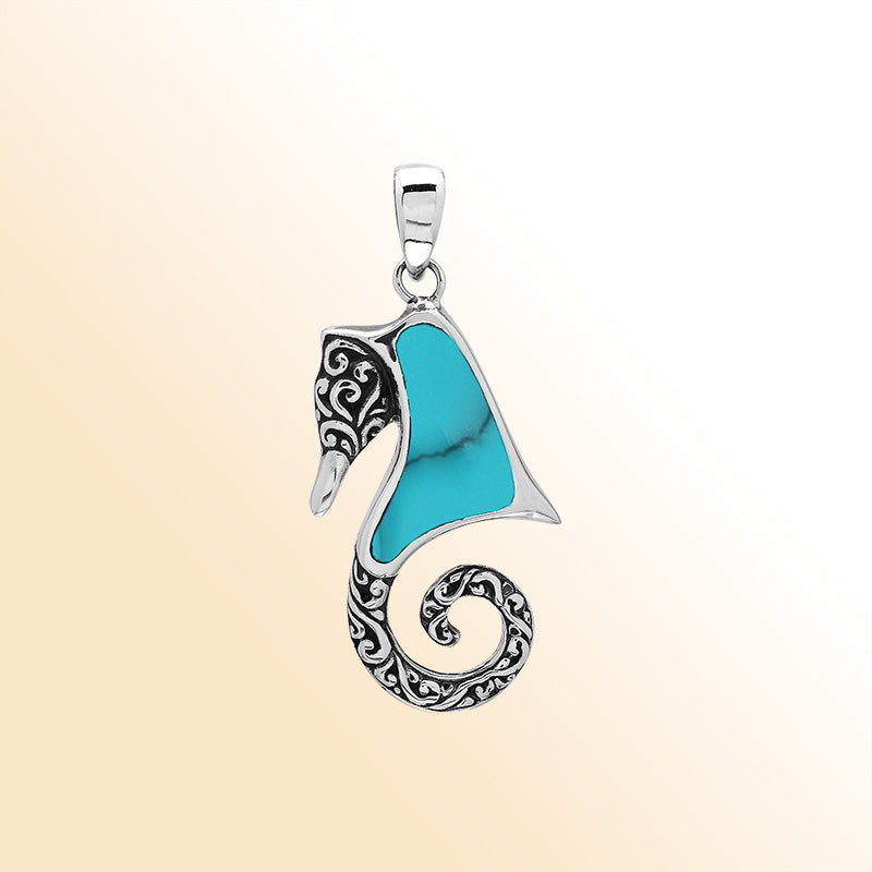 Sterling silver seahorse pendant with turquoise shell inlay, handcrafted in Bali.