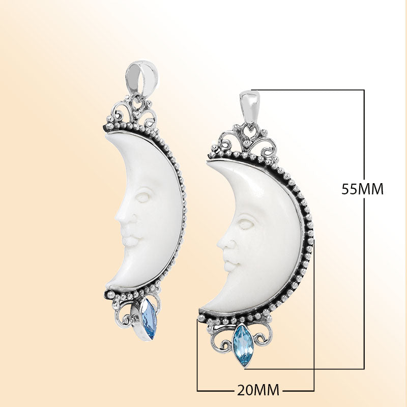 Crescent moon face pendant in sterling silver with carved bone and sparkling blue topaz quartz accent, handmade in Bali.