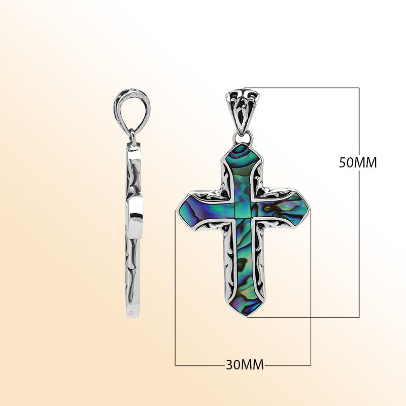 Abalone shell cross pendant in sterling silver with intricate Balinese design, handcrafted jewelry.