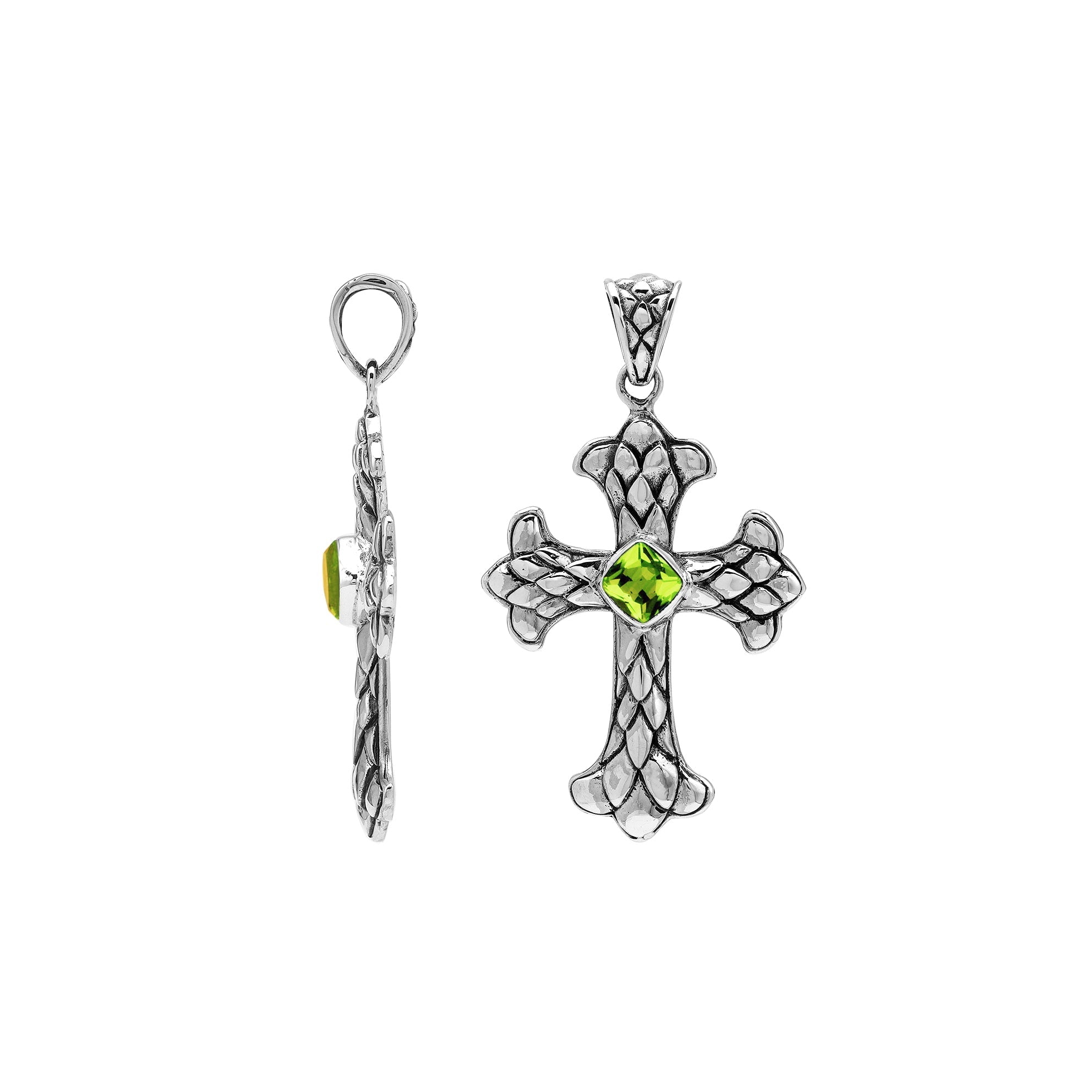 Peridot gemstone cross pendant in sterling silver with handcrafted Balinese silverwork, spiritual artisan jewelry.