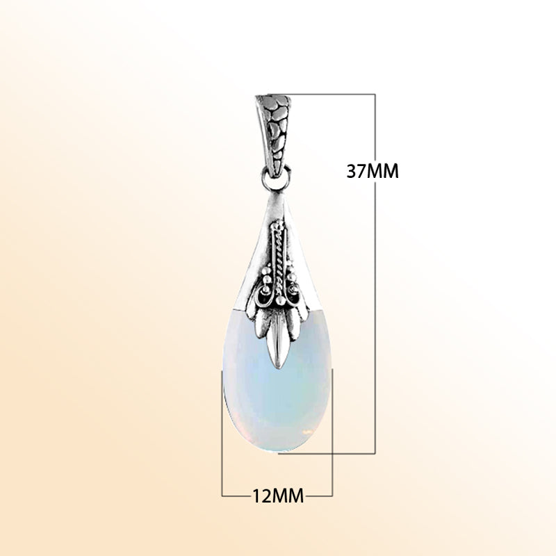 Sterling silver teardrop pendant with glowing opalite, Bali handcrafted jewelry.