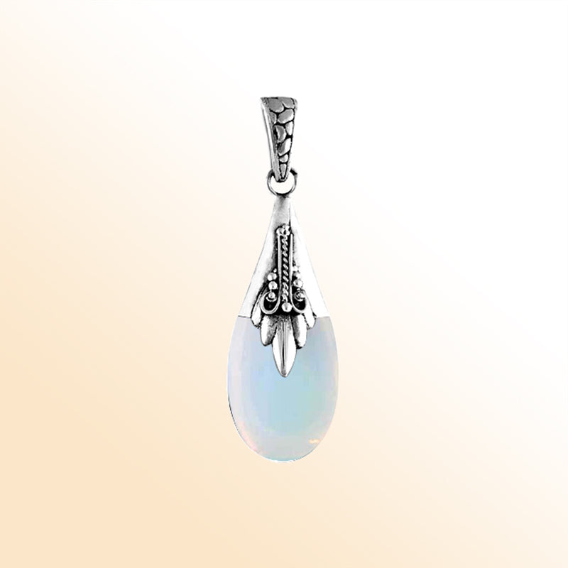 Sterling silver teardrop pendant with glowing opalite, Bali handcrafted jewelry.