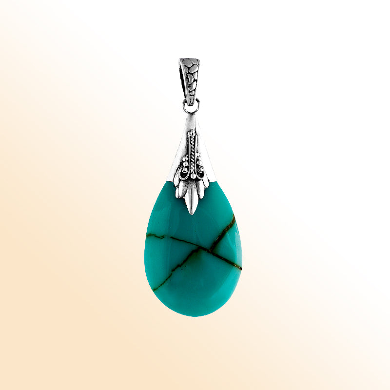 Sterling silver pendant with turquoise shell teardrop, handcrafted Bali-inspired necklace.