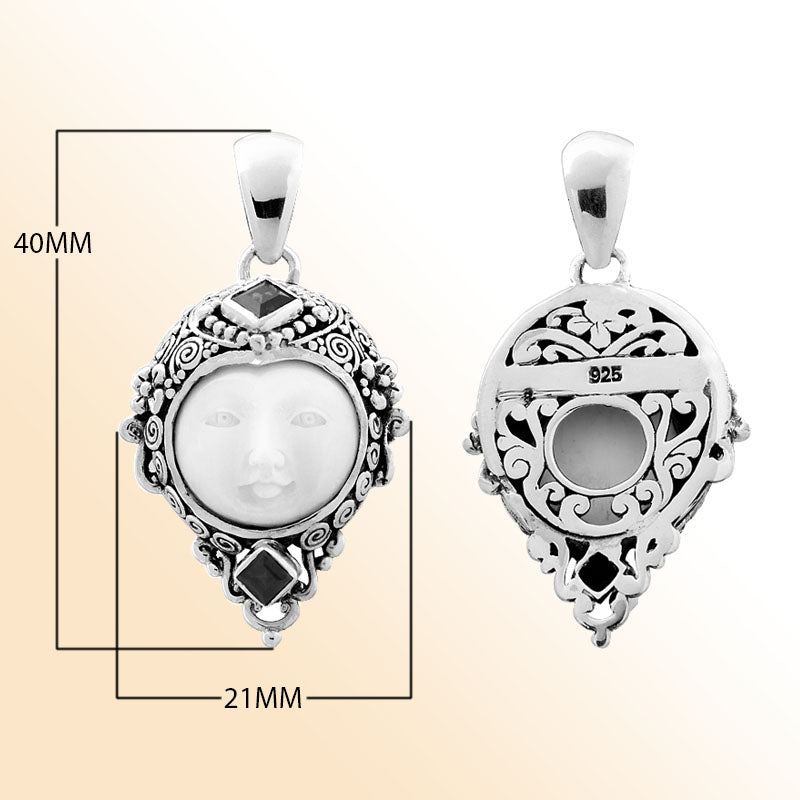 Handcrafted sterling silver pendant with Red Garnet Quartz accents and carved bone face, Bali-inspired jewelry.