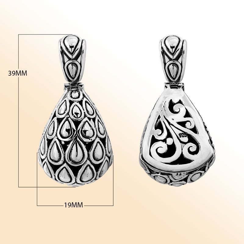 Handmade sterling silver pendant featuring teardrop droplet design on front and swirl carvings on back, Bali jewelry.