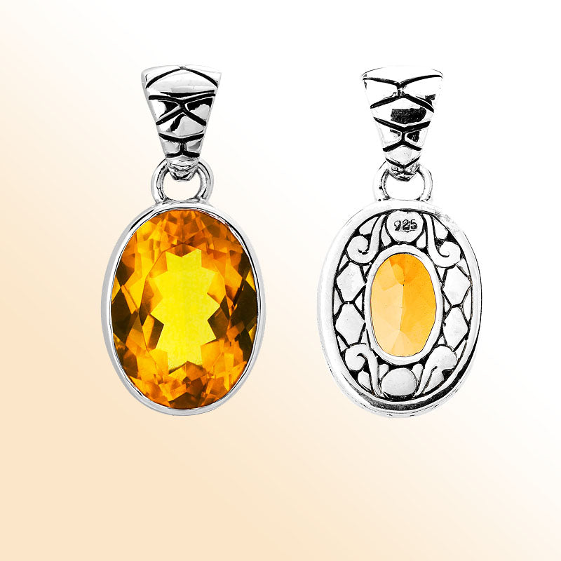 Handmade sterling silver pendant with oval-cut Citrine Quartz and artisan scroll back, Bali Quartz jewelry.
