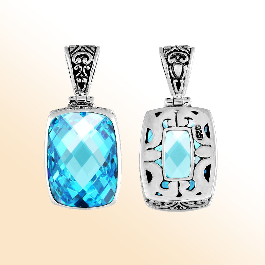 Handmade Bali silver rectangular pendant with faceted blue topaz quartz and cutwork detailing