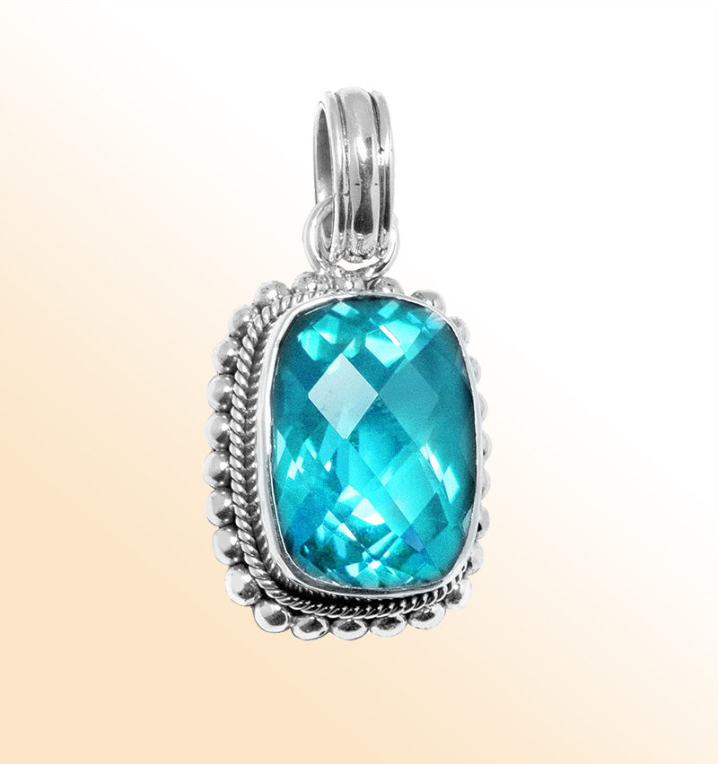 Handmade sterling silver pendant with cushion-cut Blue Topaz Quartz, artisan crafted in Bali