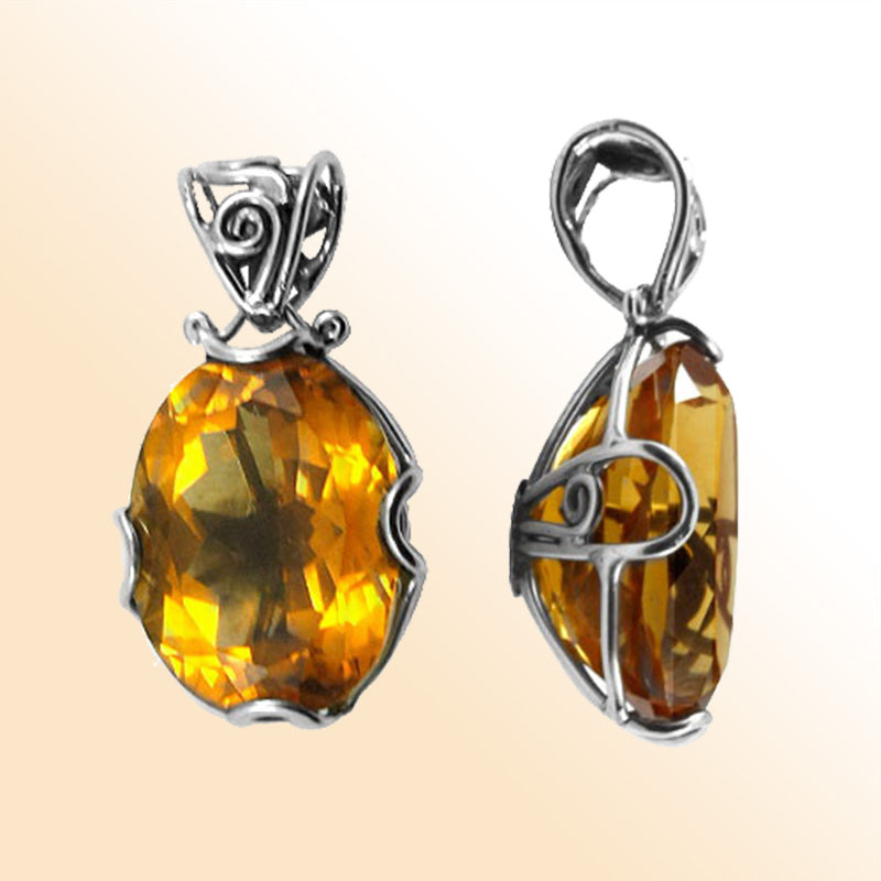 Handmade sterling silver oval pendant with faceted Citrine Quartz, artisan crafted in Bali