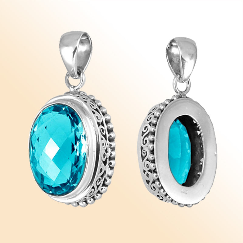 Handmade sterling silver oval pendant with faceted Blue Topaz Quartz, artisan crafted in Bali