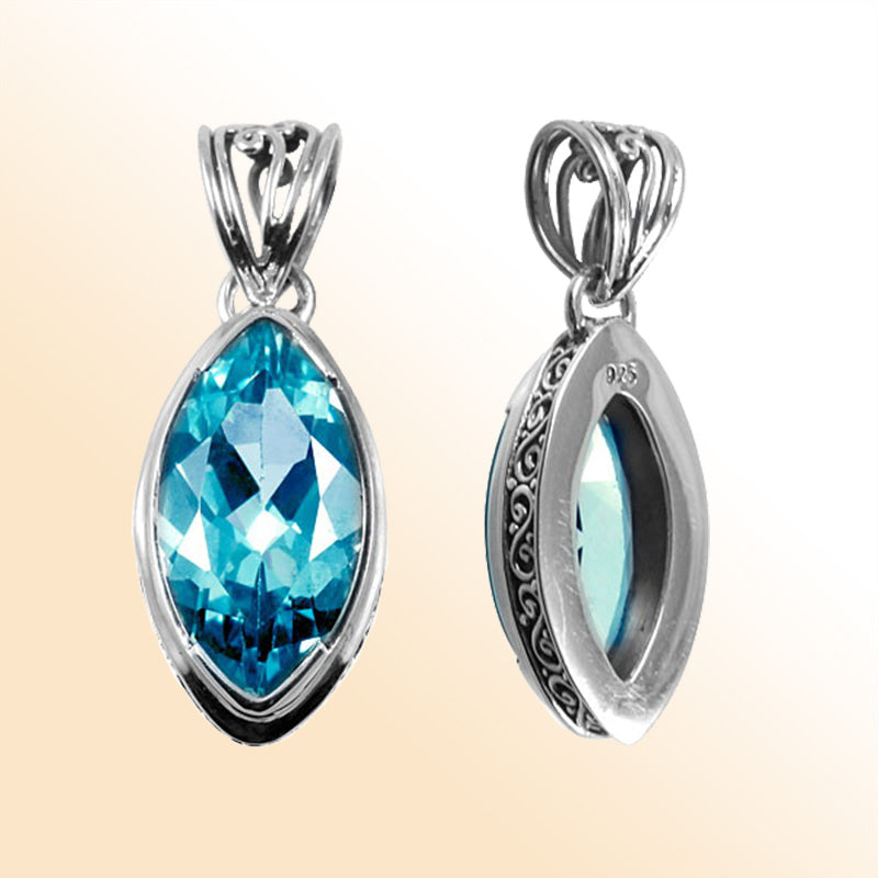 Handmade Blue Topaz Quartz marquise pendant in sterling silver with Balinese scroll accents, artisan silver jewelry from Bali.