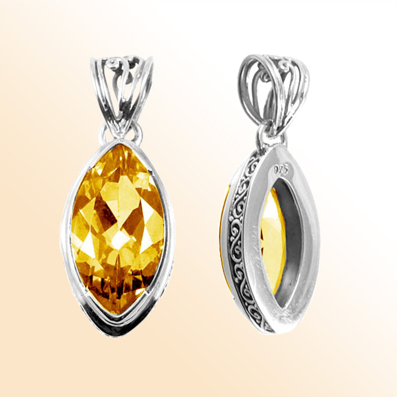 Handmade Citrine Quartz marquise pendant in sterling silver with Balinese scroll accents, artisan jewelry from Bali.