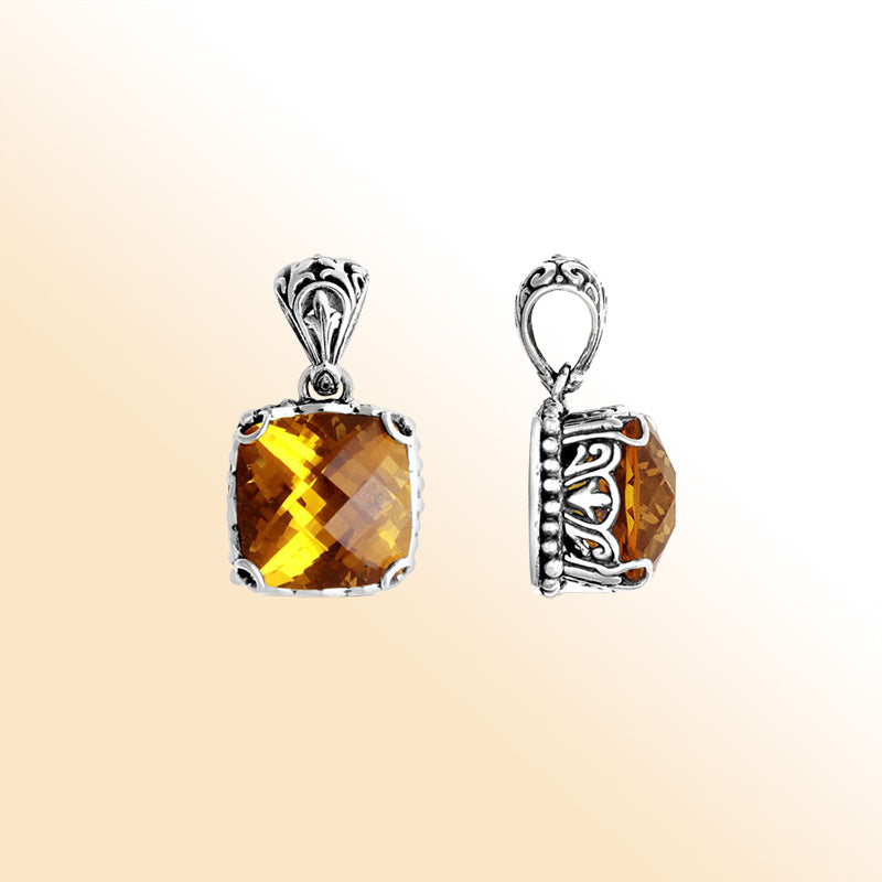 Sterling silver pendant with golden cushion-cut citrine quartz, Balinese handcrafted with bead and scroll detailing.