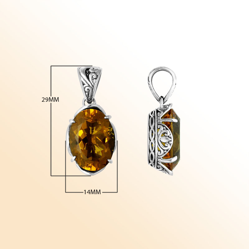 Sterling silver pendant with golden oval-cut citrine quartz, Balinese handcrafted with carved sides and oxidized finish.