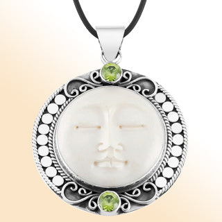 Retail Peridot Quartz pendant with carved bone face handmade in sterling silver with Balinese detailing.