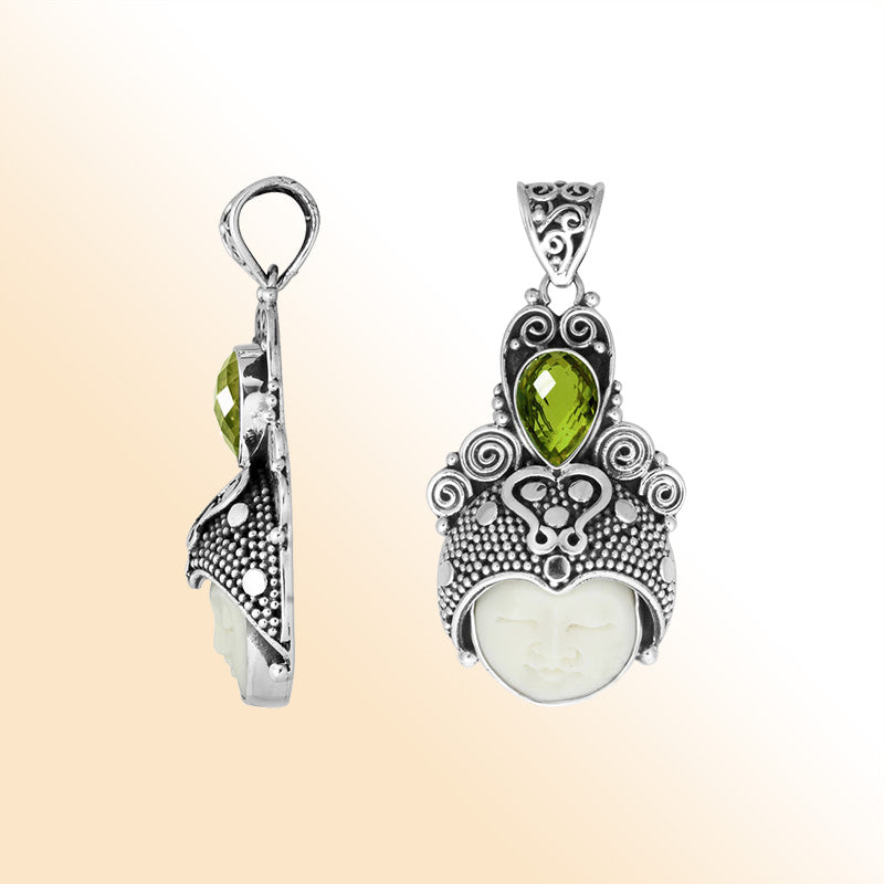 Balinese bone face pendant with peridot quartz in sterling silver, handcrafted jewelry.