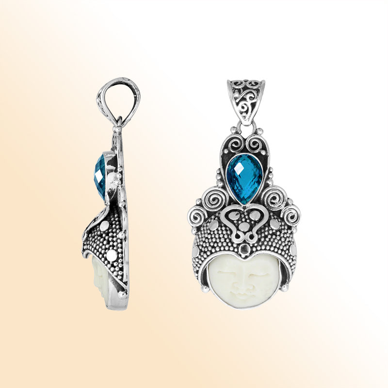 Balinese bone face pendant with blue topaz quartz in sterling silver, handcrafted jewelry.