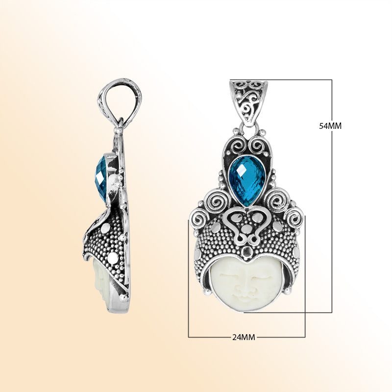 Balinese bone face pendant with blue topaz quartz in sterling silver, handcrafted jewelry.