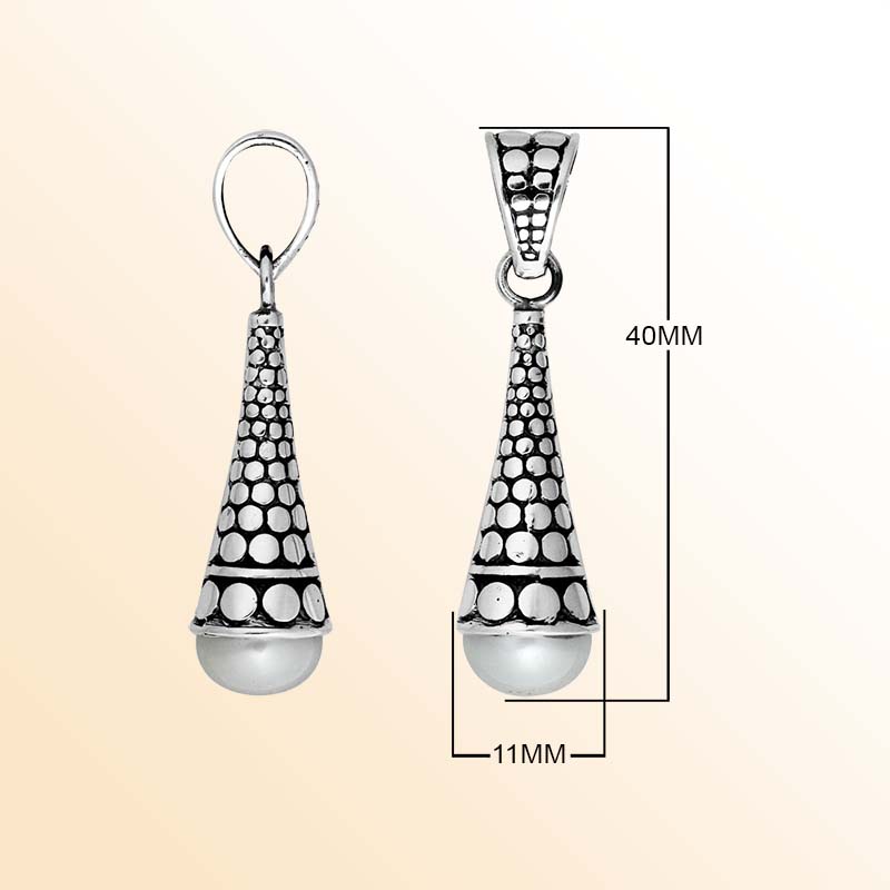 Handcrafted sterling silver pearl pendant featuring traditional Indonesian dot-work and oxidized finish.