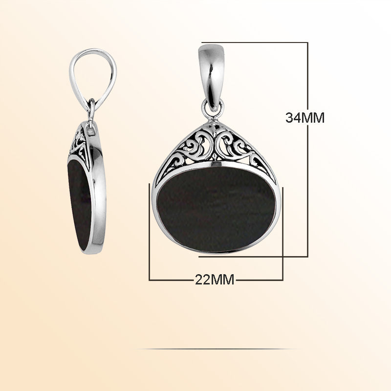 Sterling silver teardrop pendant with Black Shell inlay, elegant scrollwork, and artisan charm for sophisticated everyday jewelry styling.
