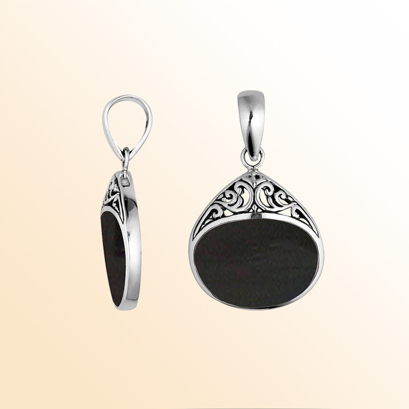 Sterling silver teardrop pendant with Black Shell inlay, elegant scrollwork, and artisan charm for sophisticated everyday jewelry styling.