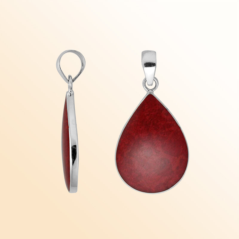 Sterling silver teardrop pendant with red coral and polished silver frame handcrafted in Bali