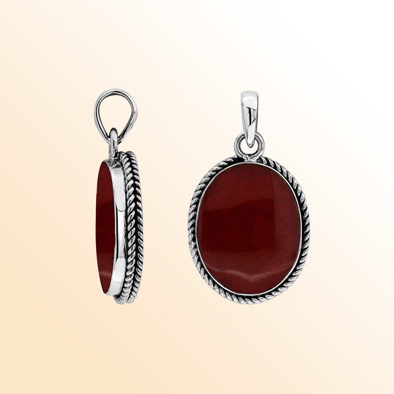 Sterling silver oval pendant with red coral and twisted rope silver frame handcrafted in Bali