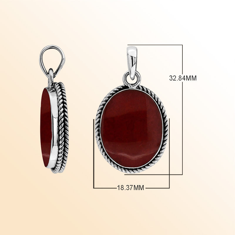 Sterling silver oval pendant with red coral and twisted rope silver frame handcrafted in Bali