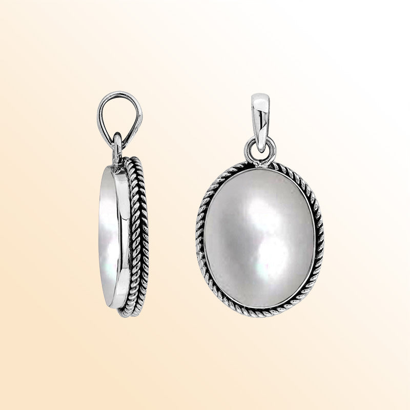 Sterling silver oval pendant with mother of pearl and twisted rope silver frame handcrafted in Bali