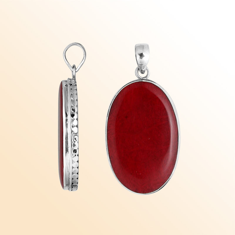Sterling silver oval pendant with red coral and hammered silver frame handcrafted in Bali