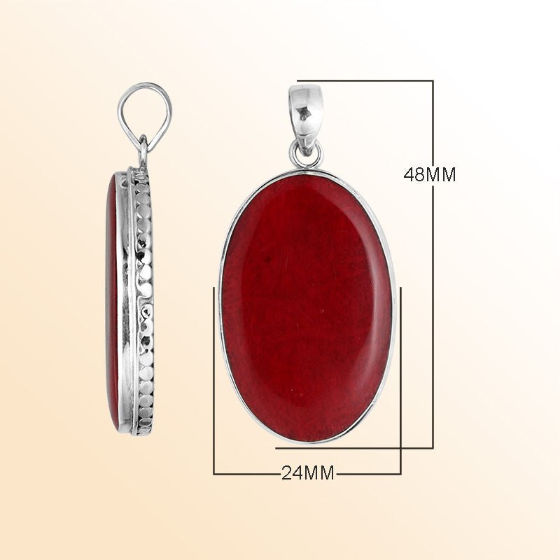 Sterling silver oval pendant with red coral and hammered silver frame handcrafted in Bali