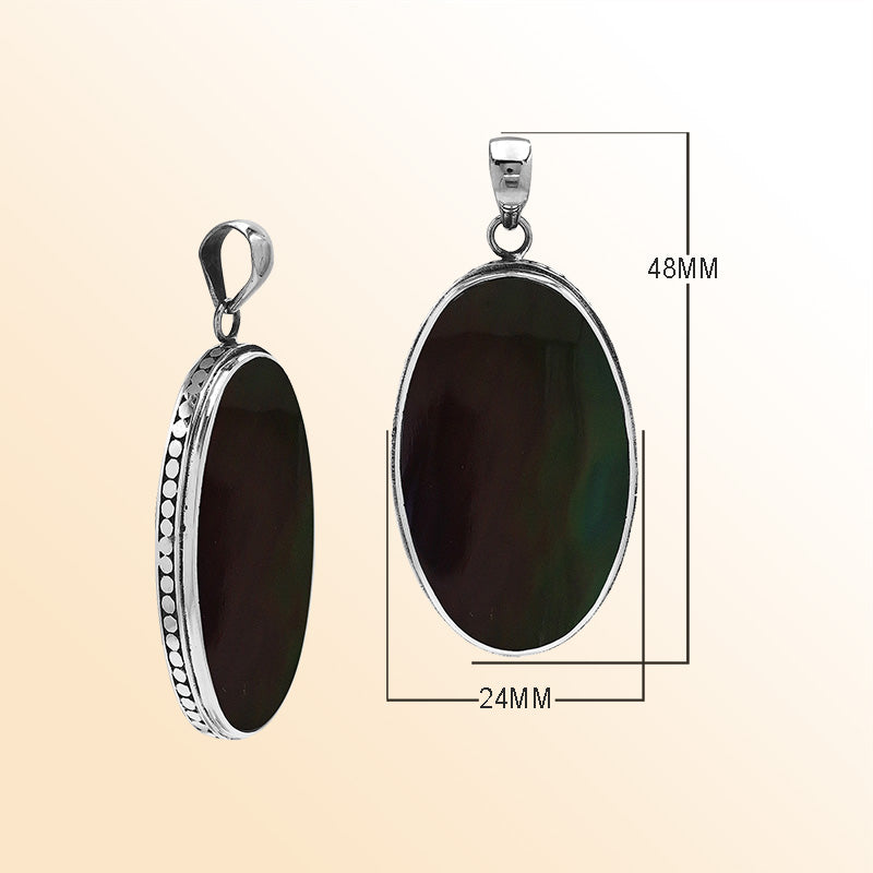 Sterling silver oval pendant with black shell and hammered silver frame handcrafted in Bali