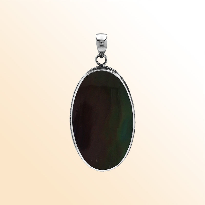 Sterling silver oval pendant with black shell and hammered silver frame handcrafted in Bali