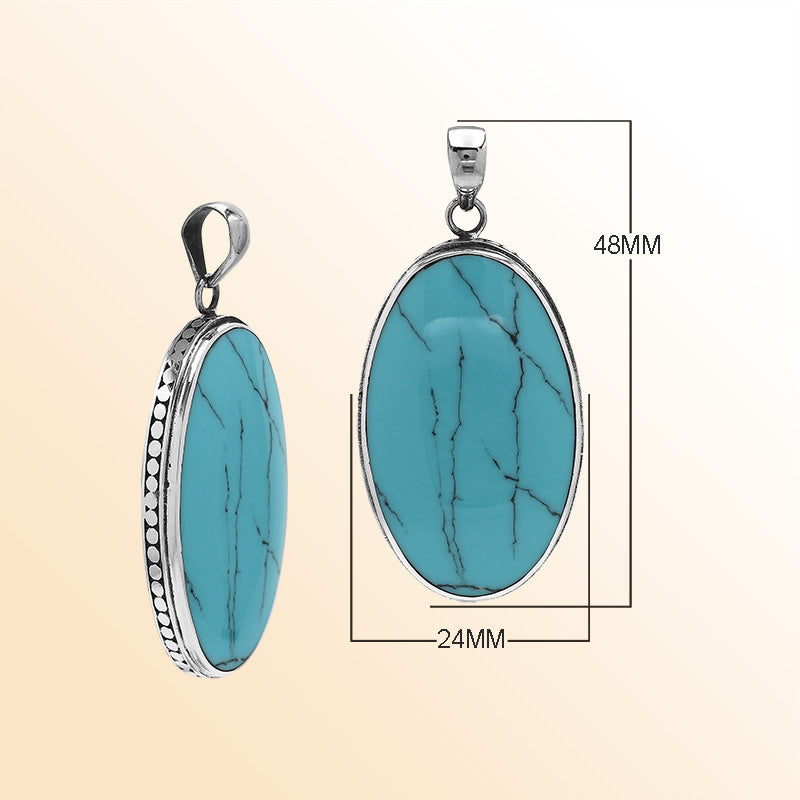 Sterling silver oval pendant with turquoise shell and hammered silver frame handcrafted in Bali
