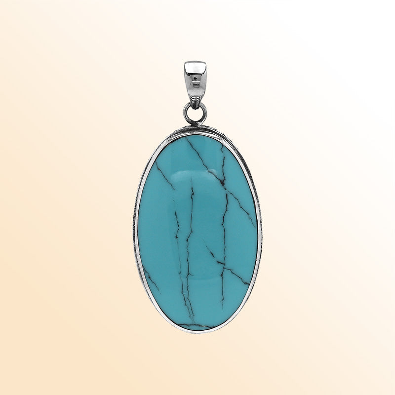 Sterling silver oval pendant with turquoise shell and hammered silver frame handcrafted in Bali