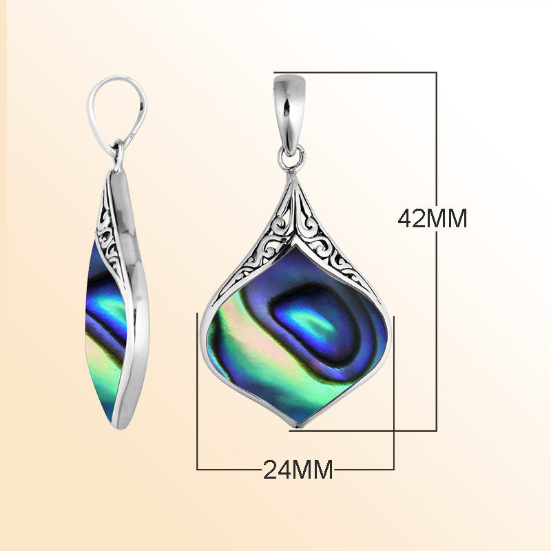 Handcrafted sterling silver pendant featuring a genuine abalone shell with shimmering blue, green, and purple tones framed in intricate Bali design – elegant ocean-inspired jewelry gift.