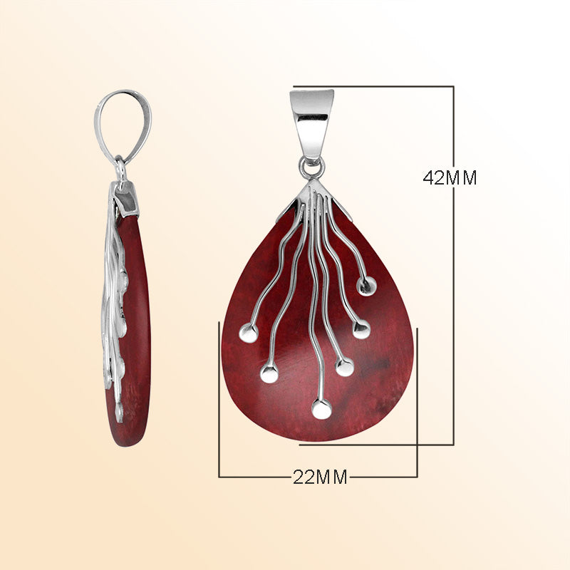 Sterling Silver Balinese Teardrop Shape Red Coral Pendant With Silver Wave Design