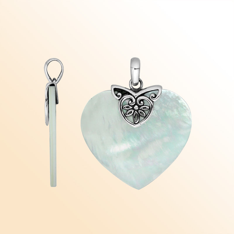 Handcrafted Sterling Silver Balinese Heart Pendant featuring lustrous Mother Of Pearl framed in detailed filigree silver work, designed for women who value timeless artistry and elegant jewelry craftsmanship.