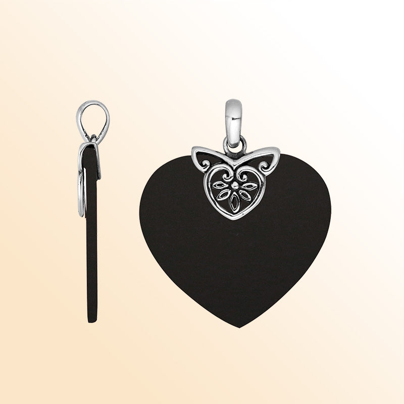 Handcrafted Balinese Sterling Silver Heart Pendant with lustrous Black Shell and delicate silver filigree detailing, designed for women who appreciate handcrafted artistry and refined jewelry elegance.