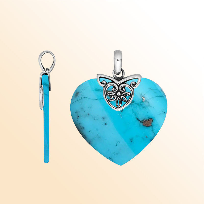 Handcrafted Balinese Sterling Silver Heart Pendant featuring a vivid Turquoise Shell center and ornate filigree bail, crafted for women who love artful island-inspired jewelry.