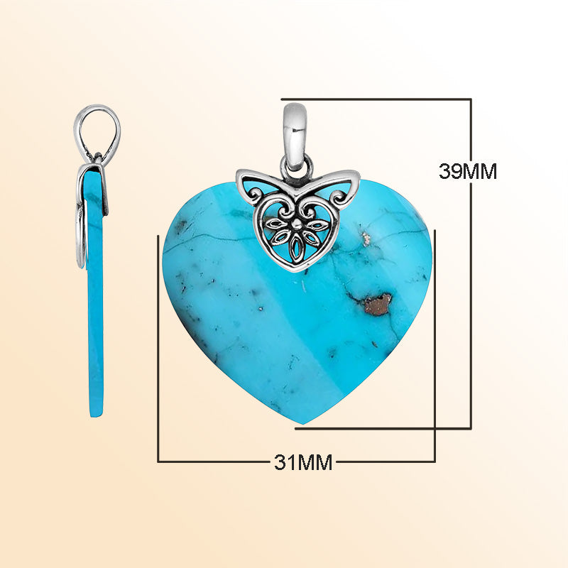 Handcrafted Balinese Sterling Silver Heart Pendant featuring a vivid Turquoise Shell center and ornate filigree bail, crafted for women who love artful island-inspired jewelry.
