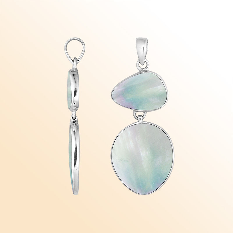 Handcrafted sterling silver pendant featuring Mother Of Pearl stones in triangular and oval shapes, smooth polished surface, and refined Balinese artistry.