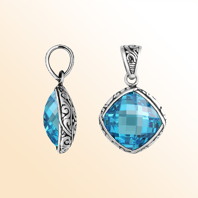 Sterling silver blue topaz quartz cushion pendant with ornate Balinese frame handcrafted in Bali.