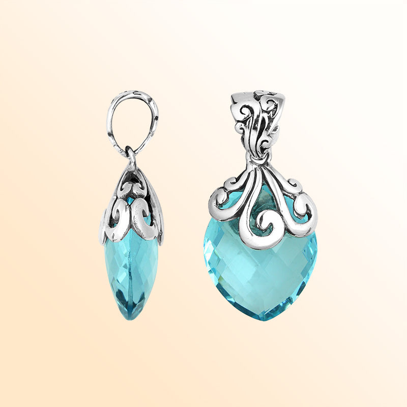 Elegant Sterling Silver Blue Topaz Quartz marquise pendant featuring handcrafted swirl filigree detailing, mirror-polished surface, and bright aqua-blue brilliance for women’s artistic jewelry collections.