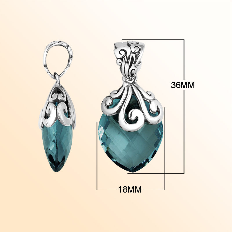 Elegant Sterling Silver London Blue Topaz Quartz marquise pendant with intricate swirl filigree bail, mirror-polished finish, and brilliant blue tone for women’s artistic jewelry collections.