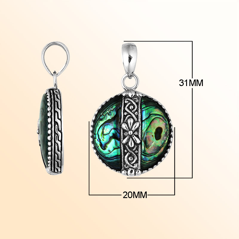 Elegant Sterling Silver Abalone Shell round pendant featuring floral center pattern, handcrafted mirror-polished finish, and iridescent blue-green hues for women’s artistic jewelry collections.