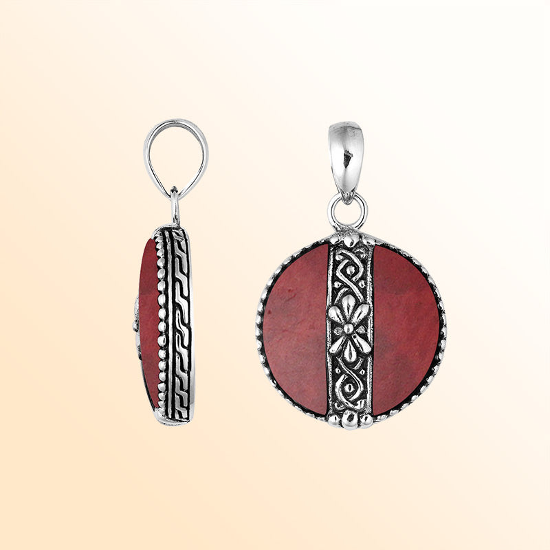 Elegant Sterling Silver Red Coral round pendant featuring handcrafted floral center pattern, mirror-polished finish, and bold red tone for women’s artistic jewelry collections.