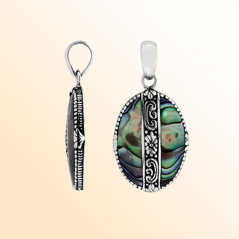Elegant Sterling Silver Abalone Shell oval pendant with handcrafted floral center detailing, mirror-polished glossy surface, and ocean-inspired iridescence for women’s artistic jewelry collections.